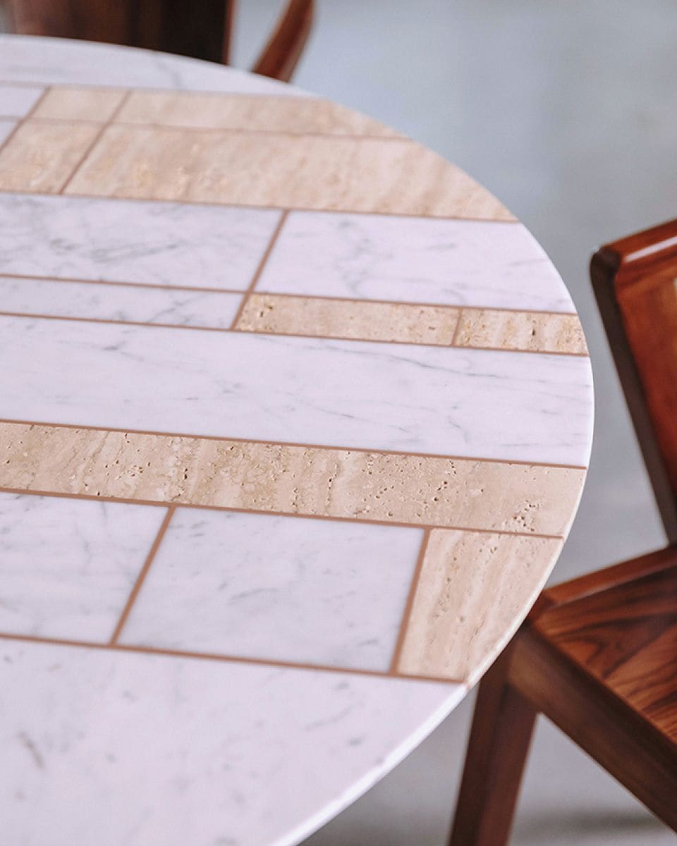ECO NIBBLES round table top in Carrara marble and travertine, with walnut chairs